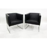 Two mid 20th century black leather tub type chairs on chrome base (2)