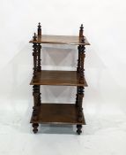 19th century walnut three-tier whatnot, satinwood stringing, on turned column supports and