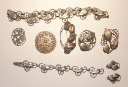 Suite of white metal jewellery of a leaf design comprising necklace, bracelet and earrings, two