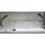 Suite of assorted glassware to include wine glasses, tumblers, water jug, etc and a paperweight