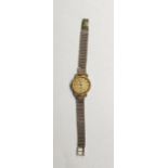 Lady’s gold-coloured Longines wristwatch with stainless steel back and the 9ct gold flexible mesh