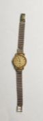 Lady’s gold-coloured Longines wristwatch with stainless steel back and the 9ct gold flexible mesh