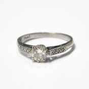 Solitaire diamond ring, approx. 0.5ct, platinum shank and setting, small diamonds to shoulders, ring