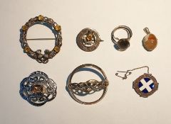 Scottish silver brooch of circular design, decorated with central paste set thistle and various