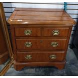 20th century yew bedside chest of drawers, the rectangular top with canted corners, fluted