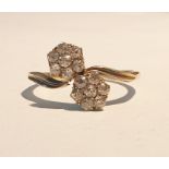 18ct gold and diamond double flowerhead crossover