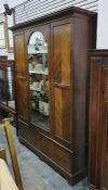 Late 19th/early 20th century wardrobe with single arched top mirror and central drawer, above two