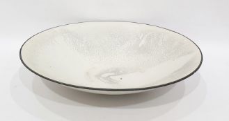 Large pottery bowl of shallow circular form with a white crackle glaze and grey borders, signed to