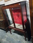 19th century walnut display cabinet with two glazed doors enclosing shelves, upon square section