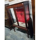 19th century walnut display cabinet with two glazed doors enclosing shelves, upon square section