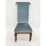 Early Victorian prie dieu chair finished in blue velour upholstery, turned front legs to white china