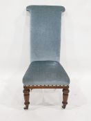 Early Victorian prie dieu chair finished in blue velour upholstery, turned front legs to white china