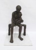 Bronze-effect sculpture of figure with child upon knee, the whole raised on a white marble base,