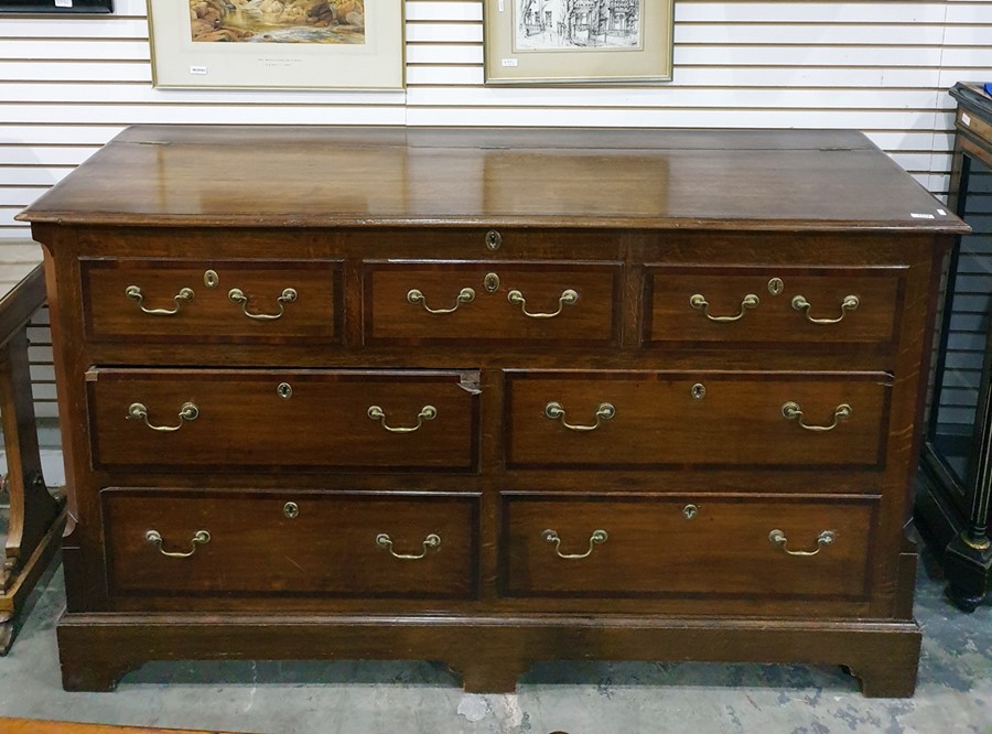 George III style oak and mahogany cross-banded North Country mule chest, the lift top with moulded