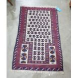 Eastern prayer-type rug, cream ground with repeating pattern motif to a stepped border, in creams,