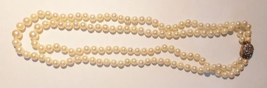 Cultured pearl necklace, twin-strand, slightly graduated and the circular diamond set clasp of