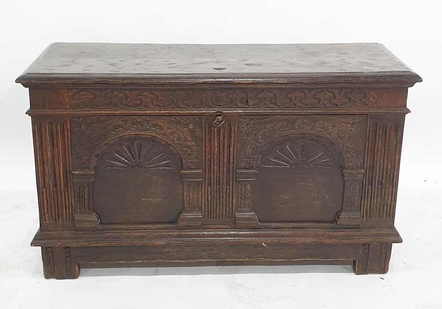 Possibly 17th century oak coffer, the rectangular top with moulded edge, opening to reveal iron