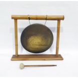 Brass gong with bamboo frame and a iron doorstop in the form of a cockerel (2)