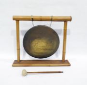 Brass gong with bamboo frame and a iron doorstop in the form of a cockerel (2)