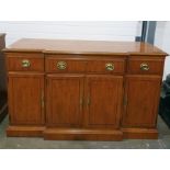 20th century yew breakfront sideboard with drawers above cupboard doors, to plinth base, 143cm x