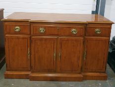 20th century yew breakfront sideboard with drawers above cupboard doors, to plinth base, 143cm x