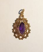 Gold-coloured metal and amethyst pendant set single oval facet-cut amethyst within openwork bark-