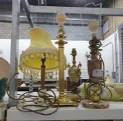 Two onyx and brass table lamps (not a pair), a brass Corinthian column style table lamp, another and