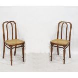 Pair of bentwood cane seated single chairs, one bearing paper label underneath, marked 'Thonet' (2)