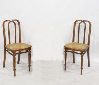 Pair of bentwood cane seated single chairs, one bearing paper label underneath, marked 'Thonet' (2)