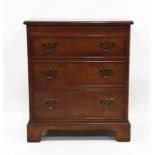 20th century burr oak-effect chest of drawers, the moulded edge above brushing slide, three drawers,