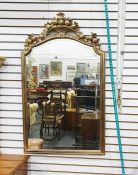 Reproduction gilt mirror with ornate fruit surmount and a rectangular wall mirror with moulded frame