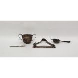 Silver two-handled sugar bowl, Birmingham 1933, of panelled form, a silver tea strainer with