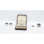 Set of four silver napkin rings by Mappin & Webb, Chester 1919, each of oval form with engine-turned