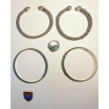 Two silver bangles, two other items and a pair of silver and enamel bangles (6)