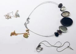 Large quantity of assorted costume jewellery to include necklaces, brooches, etc