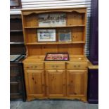 Pine dresser with two shelves above three drawers and three cupboard doors, 121cm x 180cm