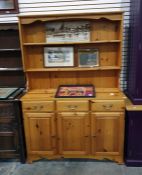Pine dresser with two shelves above three drawers and three cupboard doors, 121cm x 180cm