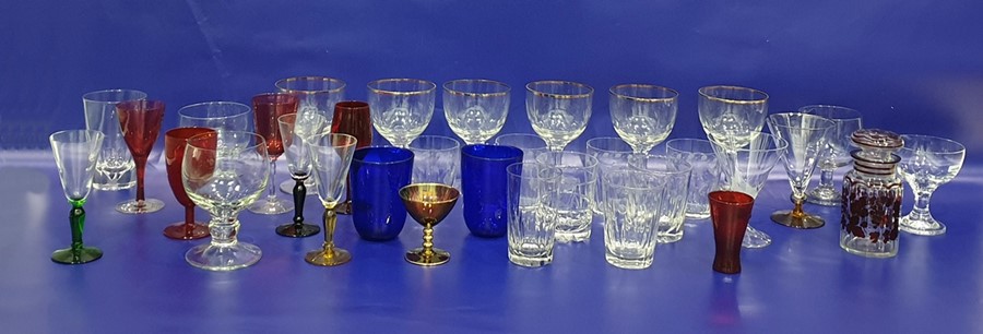 Set of four tumblers with etched design to the body, various further tumblers, wines and coloured