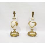 Pair of gilt brass and polished white stone table lamps, the turned bodies with brass faun head