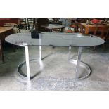 1970's designer glass topped boardroom table on curved chrome end supports and six button-back brown