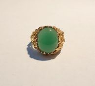 Gold-coloured and green hardstone ring set single oval cabochon stone in rockwork style abstract