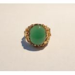 Gold-coloured and green hardstone ring set single oval cabochon stone in rockwork style abstract