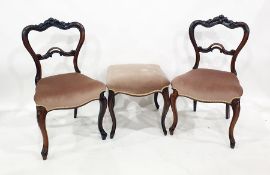 Pair of Victorian mahogany bedroom chairs with carved back rails, upholstered seats, on cabriole