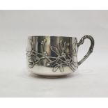 French silver mug, maker's mark 'CM' with a rose between, of shallow form decorated with mistletoe