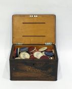 Rosewood and inlaid box and contents of assorted tokens