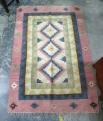 Cream ground rug with three central medallions in pinks, blues, browns, yellows and greens, 182cm