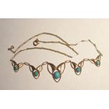 Edwardian gold necklace formed of five graduated links, of Art Nouveau design, each set with a