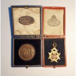 9ct gold swimming prize fob, approx 6.4g, a silver 'Talbot' brooch and a bronze medal for a two mile