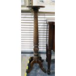 Turned dish-top oak plant stand with turned and carved column, to four cabriole supports, 111cm high
