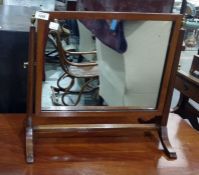 19th century mahogany rectangular swing framed mirror, the frame united by stretcher, on cabriole